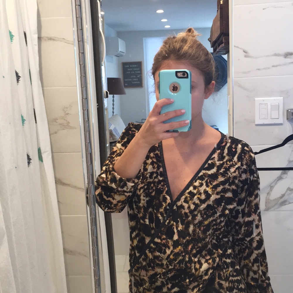 Animal print wrap blouse w/ black leather piping